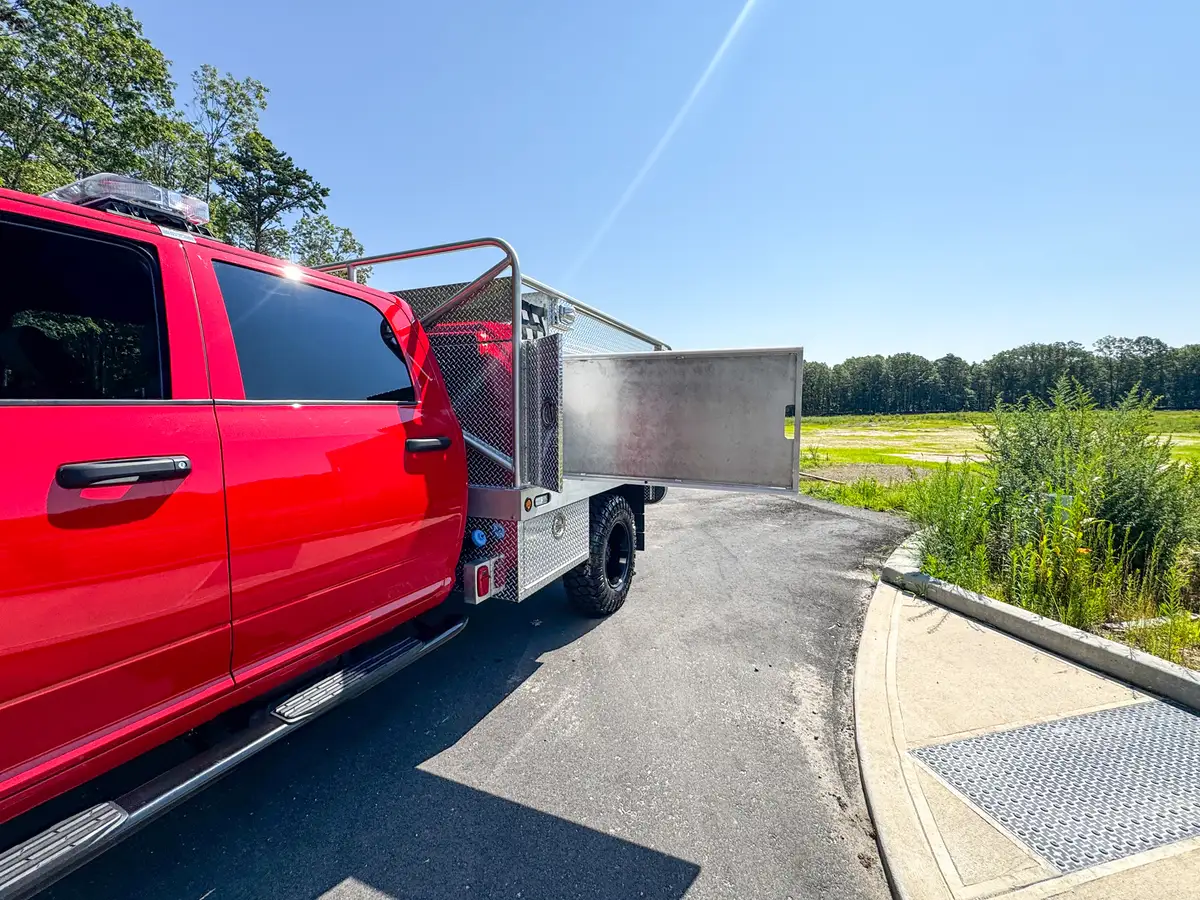 Open side storage bay view with long compartment door fully extended.